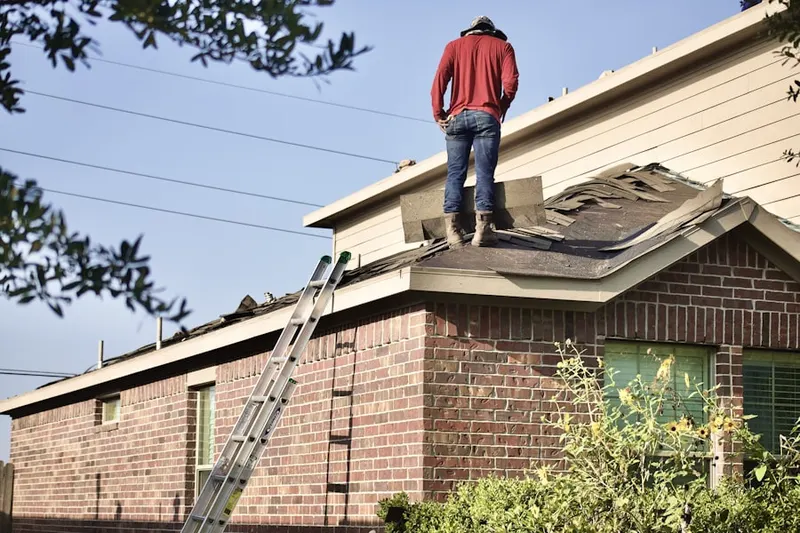 Professional roofer working on a residential roof in Downtown Edmonds